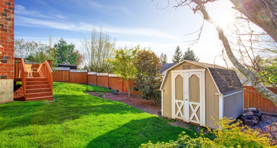 Fenced backyard with storage shed in Cedar Rapids